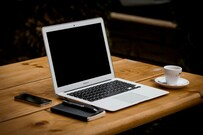 MacBook_Air_near_mug_on_table-Alejandro_Escamilla-5000x3333-yC-Yzbqy7PY.jpg